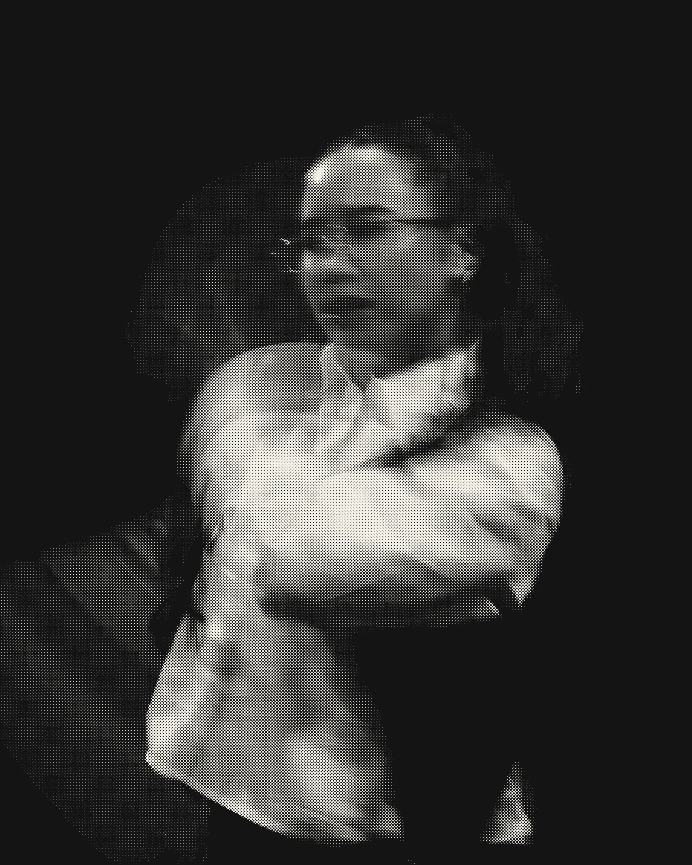 A woman turning mid-motion as a black halftone